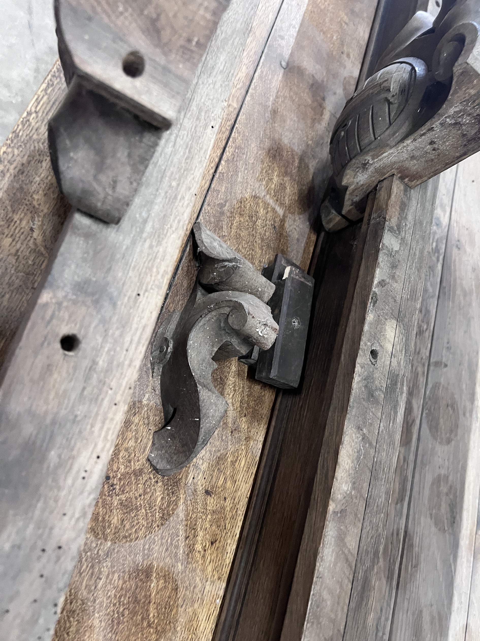 A pair of shield carved oak pediments, width 149cm, height 27cm